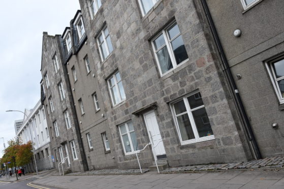 Entrance door and building  to the block of flats which includes 16 Gallowgate.

Relates to a court story about Mariusz Rjatin trashing the flat because he was paranoid due to substance abuse and thought there were cameras there.

Picture by Paul Glendell     06/10/2020