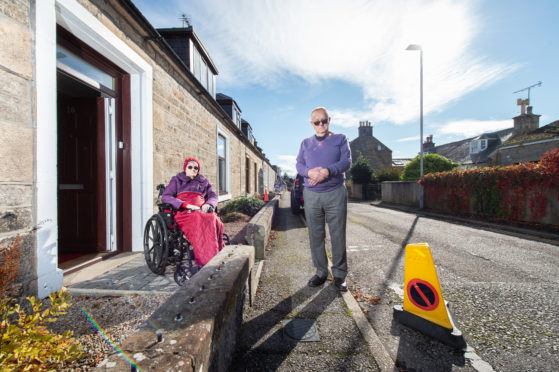 Elgin couple Pearl and Alan Riddell feel 'trapped' inside their own home on Academy Street as motorists park outside blocking their entrance.
Picture by Jason Hedges.