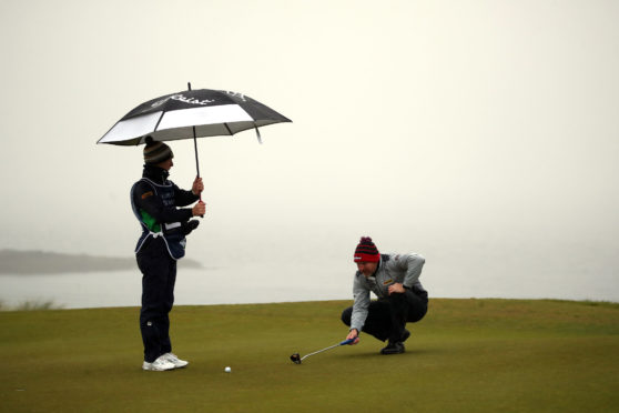 Scotland's Stephen Gallacher lines up a putt on the twelfth green during the first round of the Aberdeen Standard Investments Scottish Open at the The Renaissance Club.