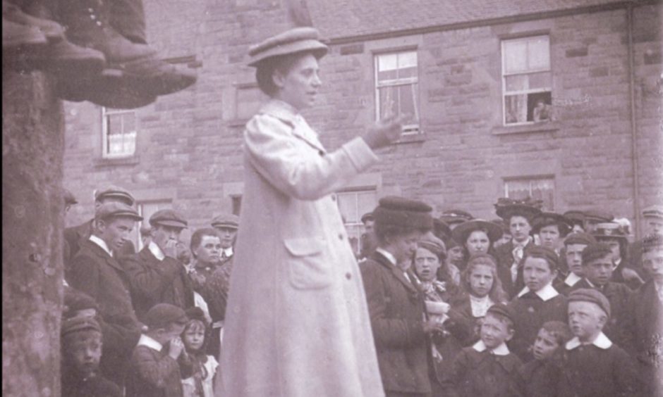 A suffragette, believed to be Adela Pankhurst - daughter of Emmeline - at an open-air meeting in Perth in 1908.