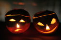Traditional carved turnips are lit up to scare off spectres