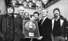 Aberdeen's home-grown superstar Annie Lennox and her then band, The Tourists, receive a silver disc from Lord Provost William Fraser at the Town House in 1980. It was for sales of the band's album, Reality Effect. Left to right are Peter Coombes, Annie, Eddie Chin, Jim Tooley, Lord Provost Fraser and Dave Stewart.