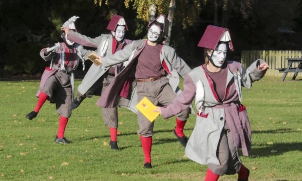 Street performers in Grant Park in Forres.