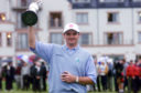 Scotland's Paul Lawrie holds the Claret Jug aloft after winning the 1999 Open Championship at Carnoustie, Scotland, after a play-off with Justin Leonard and Jean Van De Velde.