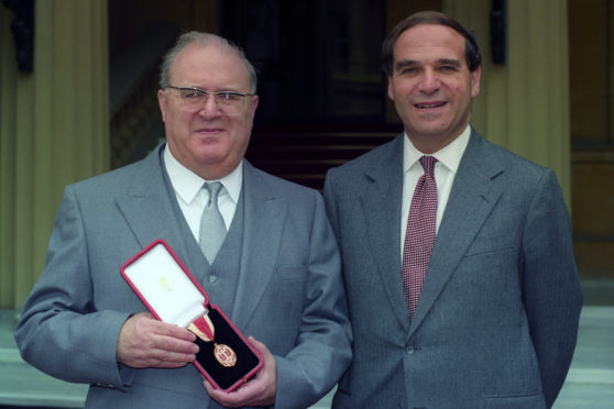 Sir Samuel Brittan with his brother Sir Leon Brittan at Buckingham Palace following Sir Samuel's investiture.