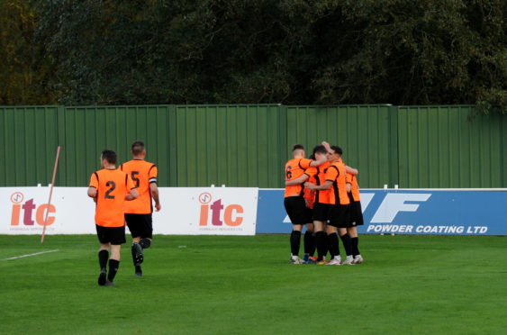 Rothes' players celebrating after making it 2-1 in extra-time against Formartine at North Lodge Park. 
Picture by Darrell Benns