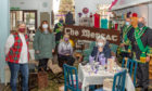 Pictured at The Mercat are Liz Wilson (volunteer with Retro Rooms) Maggie Driver (Proprietor of Mercat) Eric MacGregor (Provinchial Grand Master of Banffshire) Pauline Miller (artist/crafter) George Wilson (substitute Grand Master of Banffshire) Liz Lyall (Pict Design) Neil Stephen (Deputy Provinchial Grand Master of Banffshire).