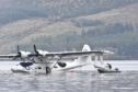 A seaplane is removed from Loch Ness by crane.
Pictures by Jason Hedges.