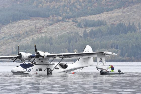 A seaplane is removed from Loch Ness by crane.
Pictures by Jason Hedges.