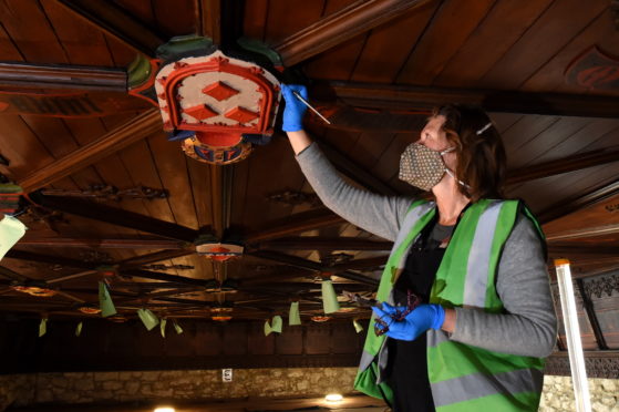 Picture of Karen Dundas touching up the shields.

Picture by Kenny Elrick