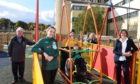 Joe Mackie, chairman of Archie Foundation, Victoria Alexander from Morrisons, frequent playground user Baxter on the swing with his mum Ailsa Dick, Sarah Brown from Morrisons and Paula Cormack, director of fundraising at Archie Foundation.