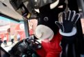 Angus the Bull on a First Bus outside Pittodrie Stadium.