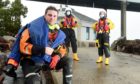 Rob Fielder is welcomed home by crew at North Kessock Lifeboat Station after his final five plus miles of his virtual run from North Kessock to the RNLI Headquarters in Poole to raise funds for the station. Picture by Sandy McCook