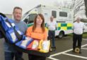 Gordon and Sandra McKandie with one of the four paramedic kits.
Picture by Sandy McCook.