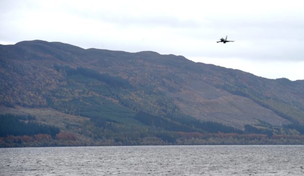 RAF Lossiemouth Typhoon flies over the spot where a Wellington bomber ditched in a snowstorm on hogmany 1940. Picture by Sandy McCook.