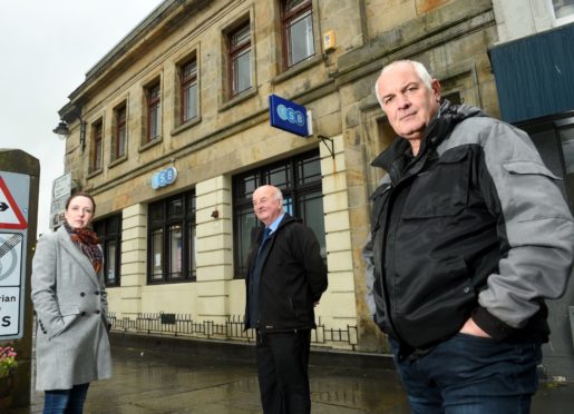 Highland Councillors, Nicola Sinclair, Willie MacKay and Raymond Bremner outside the Wick TSB branch.
Picture by Sandy McCook.