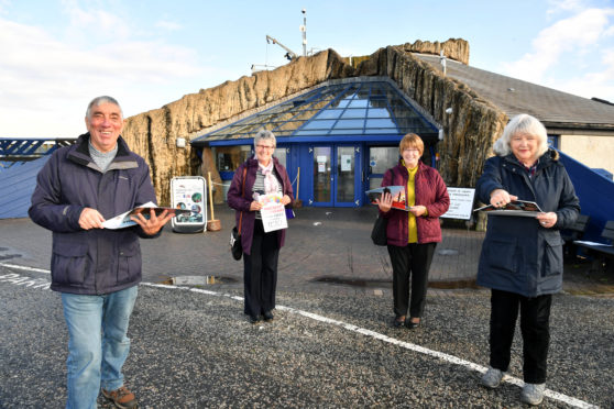 Volunteers from Friends of Tarlair and Friends of Macduff Aquarium with their 2021 fundraising calendars at the aquarium, from left, Keith Newton, Lorraine Smith, Doreen Shearer and Liz Lyall. Photo: Duncan Brown.