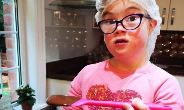 Poppy is challenging misconceptions about down syndrome with her chocolate making skills.