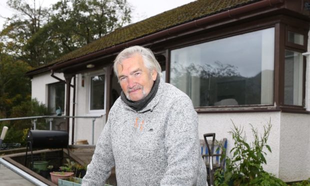 Roddy Macleod outside his home at Inverinate