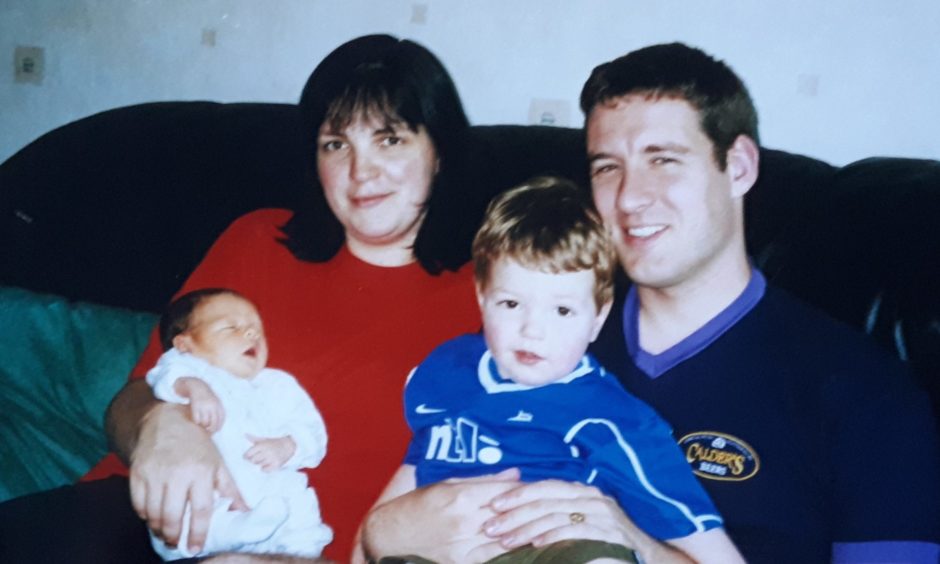 Alistair Wilson with his wife and two children