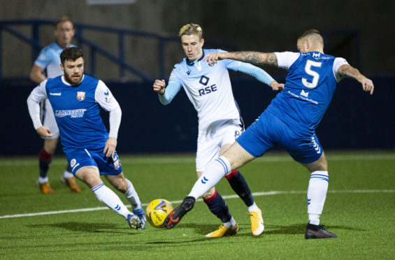 Oli Shaw, centre, in action for Ross County against Montrose