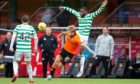 Kieran Freeman in action for Dundee United against Celtic