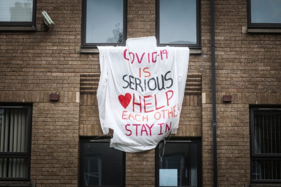 STAY SAFE: A banner encouraging people to stay in their homes during the early weeks of the Covid-19 crisis.