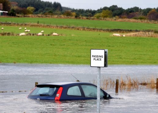 Heavy rain could cause flooding on roads.