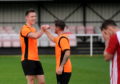 Craig Cormack, left, and team mate Alasdair Stark celebrate Rothes' Highland League Cup semi-final victory.
Picture by Darrell Benns