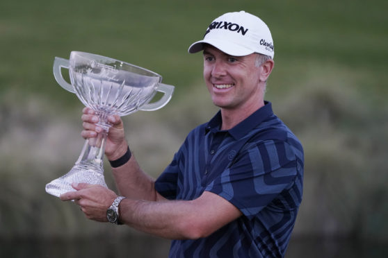 Martin Laird holds the trophy after winning the Shriners Hospitals for Children Open golf tournament in Las Vegas.