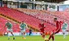 Aberdeen midfielder Lewis Ferguson scores to make it 3-3 in the game against Celtic.