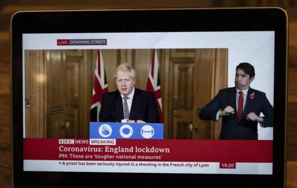 Mandatory Credit: Photo by Xinhua/Shutterstock (10990227d)
Photo taken on Oct. 31, 2020 shows a laptop screen broadcasting British Prime Minister Boris Johnson's statement in a virtual press conference in London, Britain.
  British Prime Minister Boris Johnson announced Saturday that England will enter a month-long lockdown from Thursday in a bid to quell the resurgence of the coronavirus.
Britain London Covid 19 Lockdown - 31 Oct 2020