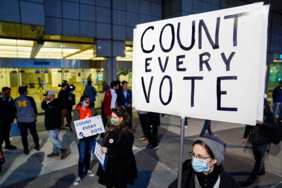 Mandatory Credit: Photo by Kent Nishimura/Los Angeles Times/Shutterstock (10996543ai)
Detroit Will Breathe supporter Betsy Camaredo of Hazel Park holds a sign that says "Count Every Vote" outside of the Detroit Department of Elections Central Counting Board of Voting absentee ballot counting center at TCF Center, Wednesday, Nov. 4, 2020 in Detroit, MI. With the surge in vote by mail/absentee ballots, analysts cautioned it could take days to count all the ballots, leading some states to initially look like victories for President Trump only to later shift towards democratic Presidential candidate Joe Biden. (Kent Nishimura / Los Angeles Times)
Ballot Counting in Michigan US Election, Tcf Center, Detroit, Mi, United States - 04 Nov 2020