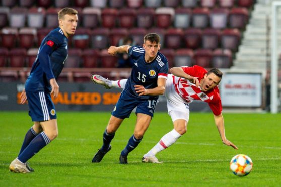 Lewis Ferguson, left, playing for Scotland Under-21s.