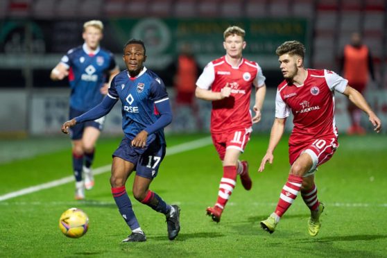 Regan Charles-Cook of Ross County sets off on an attack closely watched by Jack Leitch of Stirling Albion.