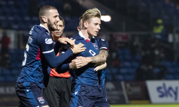 Oli Shaw celebrates scoring for Ross County.