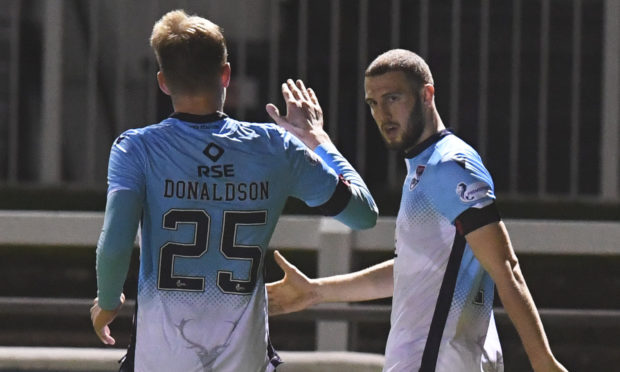 Alex Iacovitti, right, celebrates netting his first goal for Ross County.