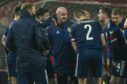 Scotland manager Steve Clarke speaks to his players during the UEFA Euro 2020 qualifier against Serbia.