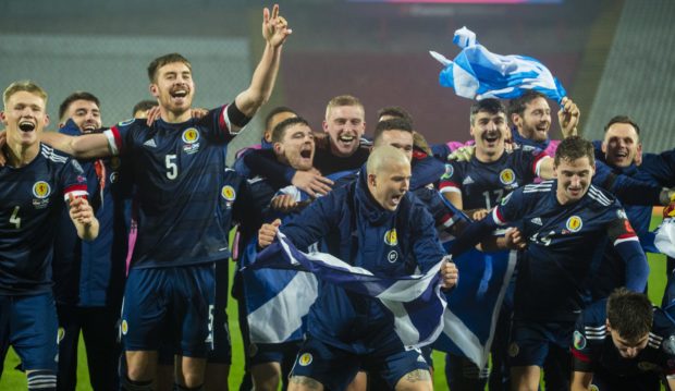 Scotland's players celebrate taking their place at Euro 2020.