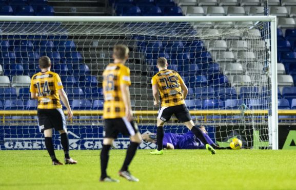 Inverness keeper Cameron Mackay saves a penalty from East Fife's Jack Hamilton.