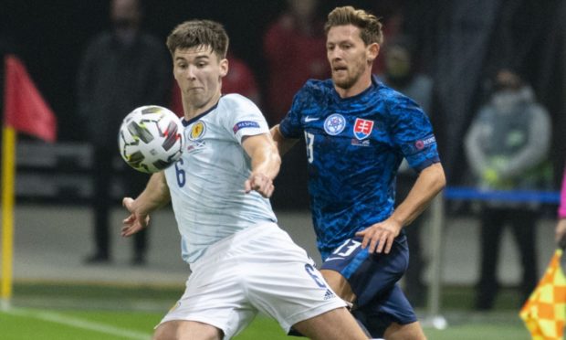 Scotland's Kieran Tierney (L) is closed down by Slovakia's Patrik Hrosovsky.