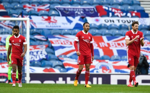 Aberdeen's Shay Logan, Funso Ojo and Ash Taylor after going 1-0 down against Rangers.