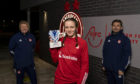 Bayley Hutchison with the SWPL player of the month award for October. Pictured with Aberdeen FC Women coaches Emma Hunter and Stuart Bathgate.