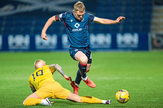 Josh Reid in action for Ross County.