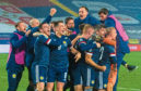 Scotland's players celebrate qualification for Euro 2020 in Belgrade.