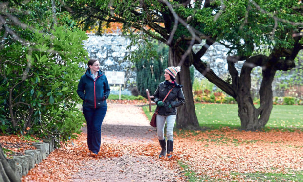 Gayle Ritchie walks through Ellon Castle Gardens with Dr Alison Craigon.