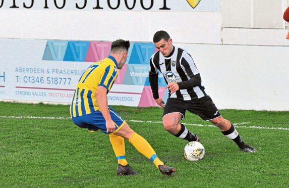 Scott Barbour, of Fraserburgh, takes on Inverurie Locos' Thomas Reid in an Aberdenshire Cup clash last week.
Picture by Paul Glendell