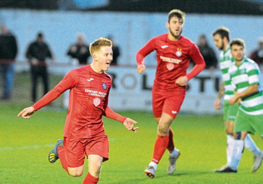 Andrew Macrae celebrates a goal for Brora. 
Picture by Jason Hedges.