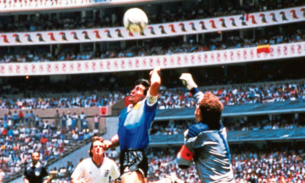 Diego Maradona scoring the 'Hand of God' goal at the 1986 Mexico world cup.