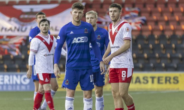 Cove's Jamie Masson and Airdrie's Paul McKay during the Scottish League One game.